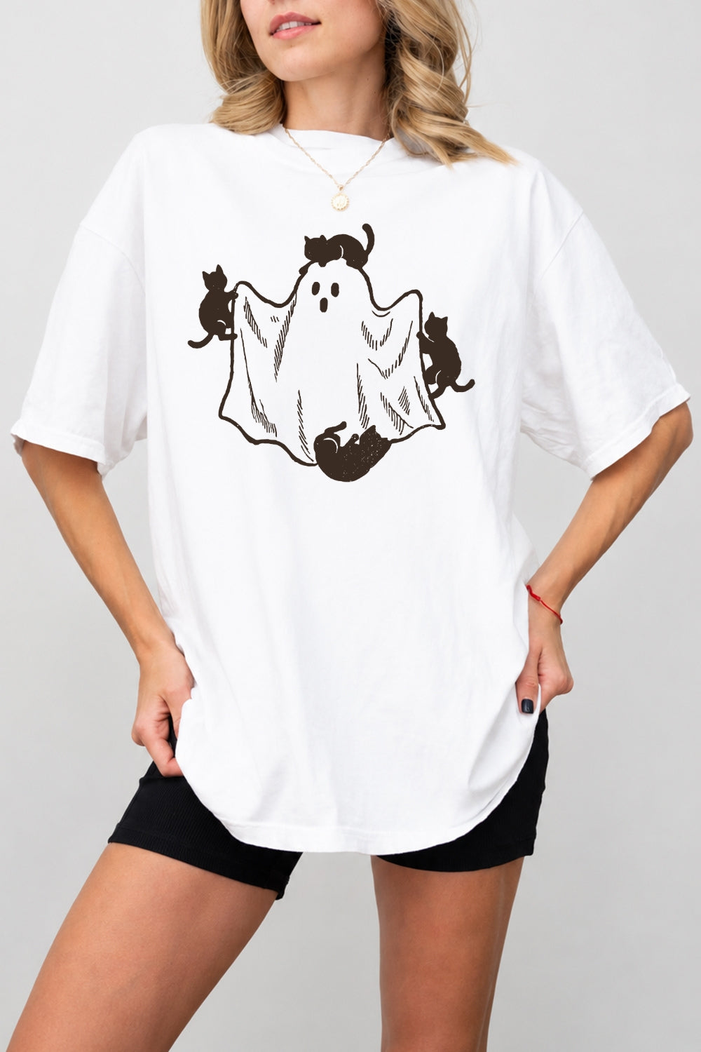 Cats playing with ghost tee