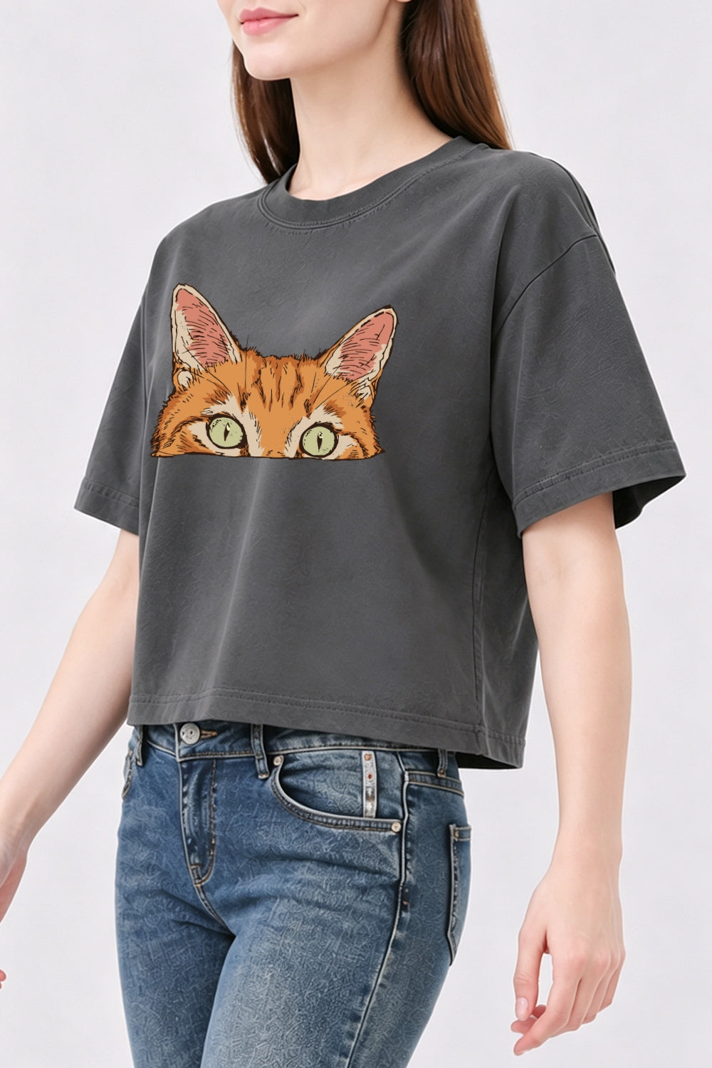 Curious orange tabby cat peeking crop top