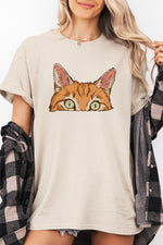 Curious orange tabby cat peeking tee