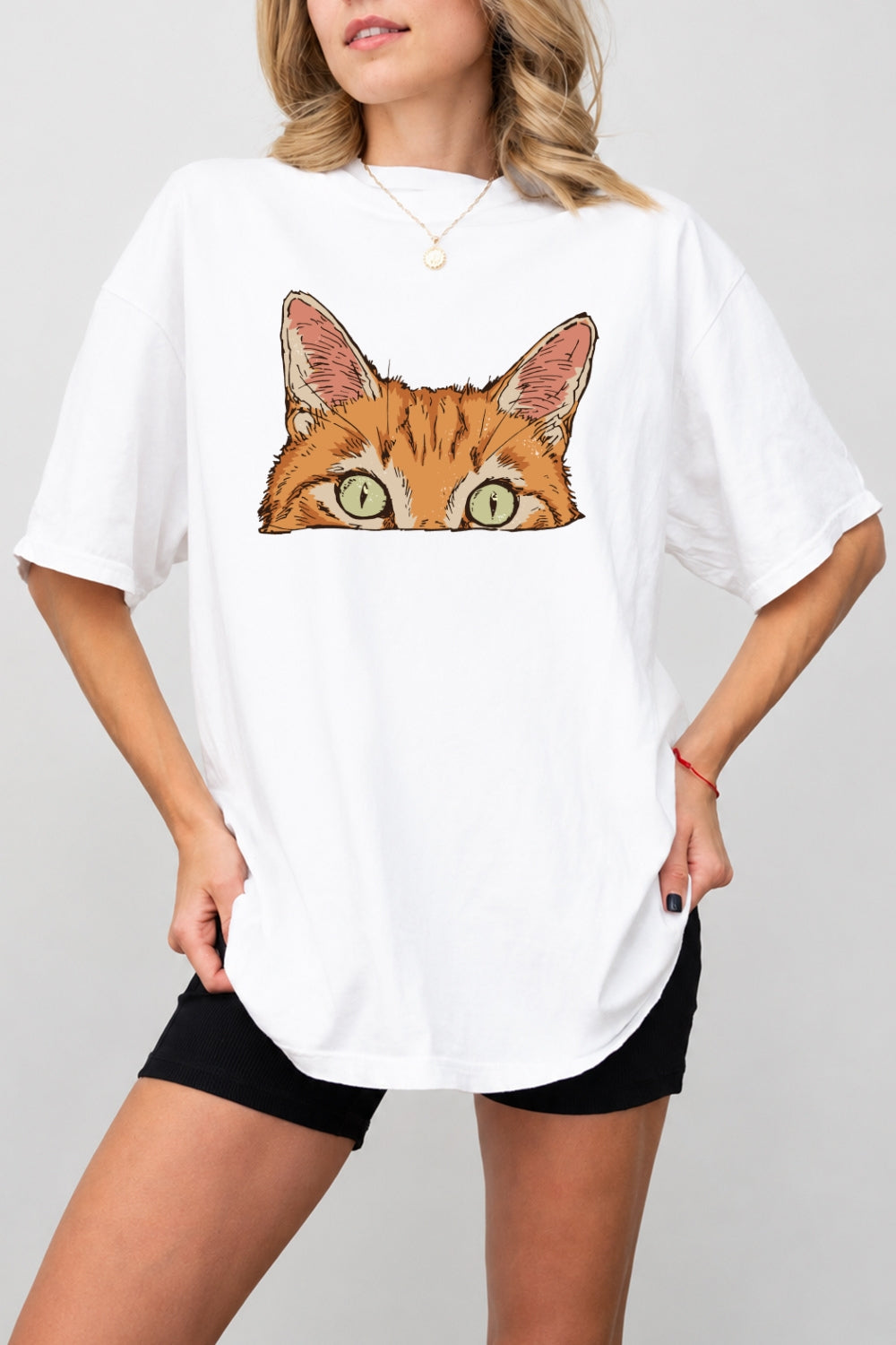 Curious orange tabby cat peeking tee