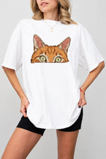 Curious orange tabby cat peeking tee