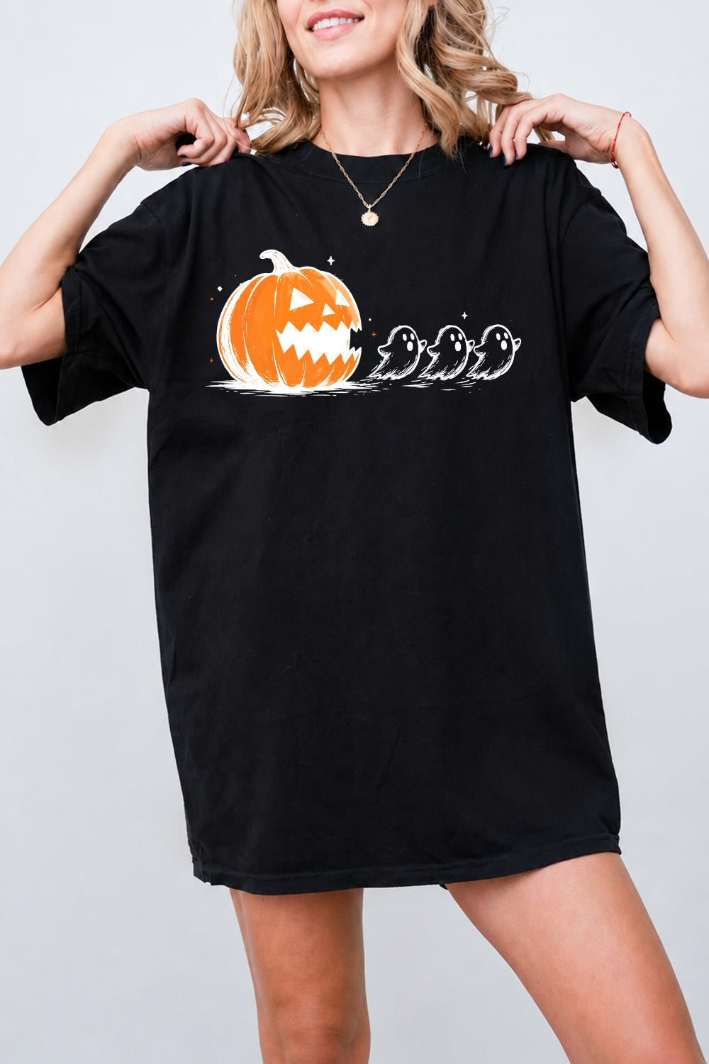 Halloween pumpkin chasing ghosts tee