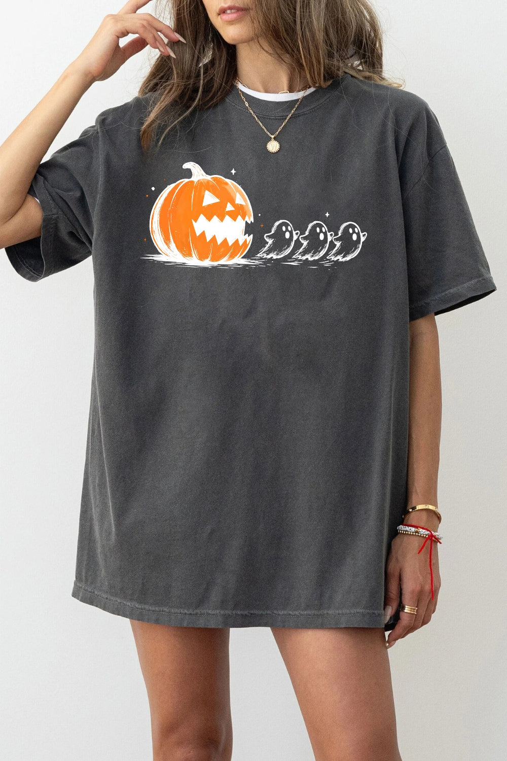 Halloween pumpkin chasing ghosts tee