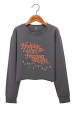Holiday lights and human rights crop sweatshirt