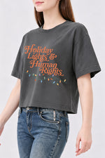 Holiday lights and human rights crop top