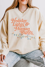 Holiday lights and human rights sweatshirt