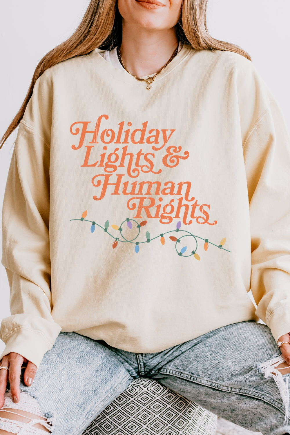 Holiday lights and human rights sweatshirt