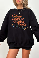 Holiday lights and human rights sweatshirt
