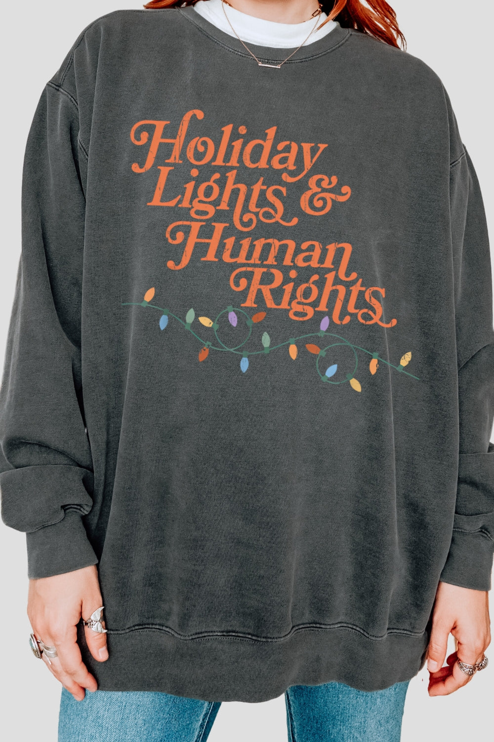 Holiday lights and human rights sweatshirt