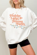 Holiday lights and human rights sweatshirt
