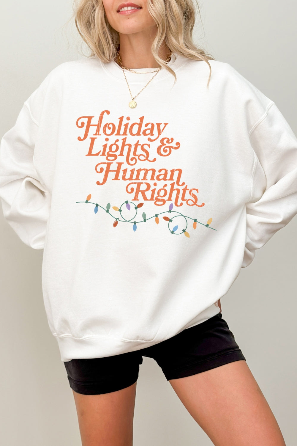Holiday lights and human rights sweatshirt