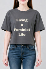 Living a feminist life crop top