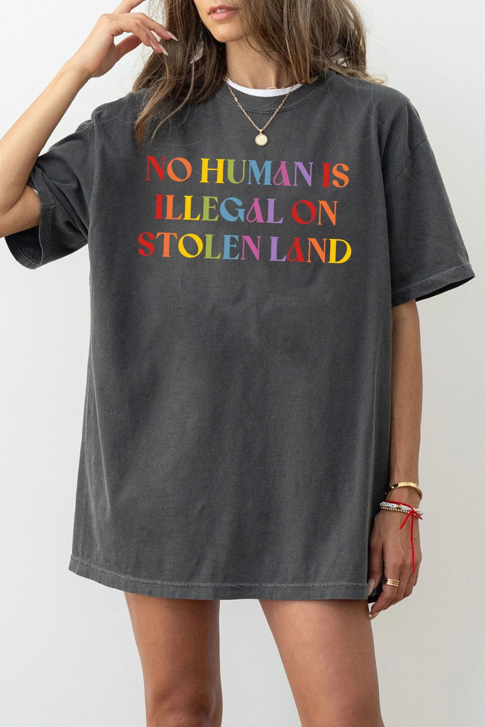 No human is illegal on stolen land tee