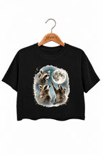 Raccoons gather around the moon crop top