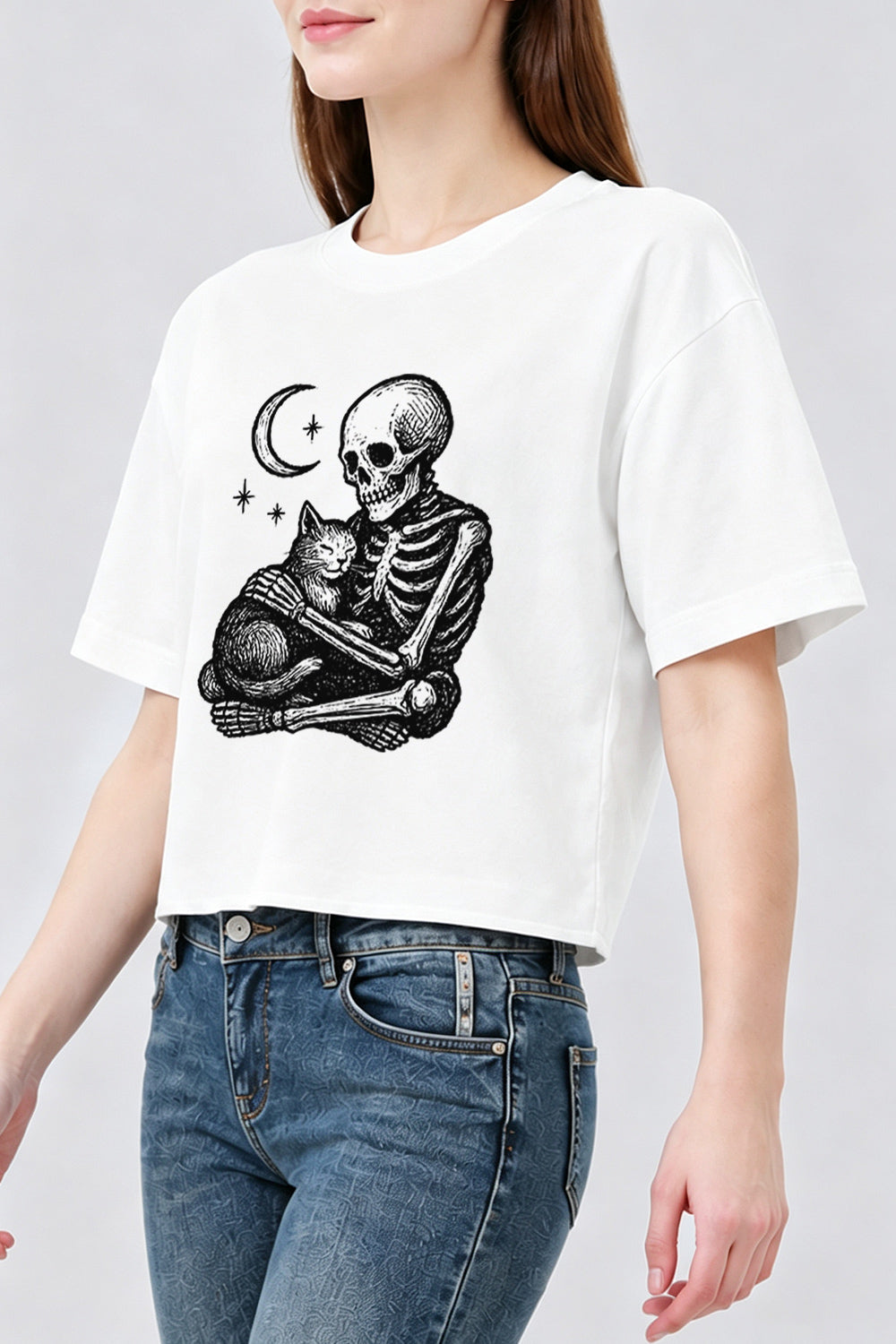 Skeleton holding a cat crop top