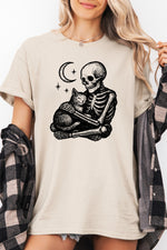 Skeleton holding a cat tee