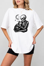 Skeleton holding a cat tee