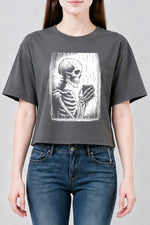Skeleton holding a hot drink crop top