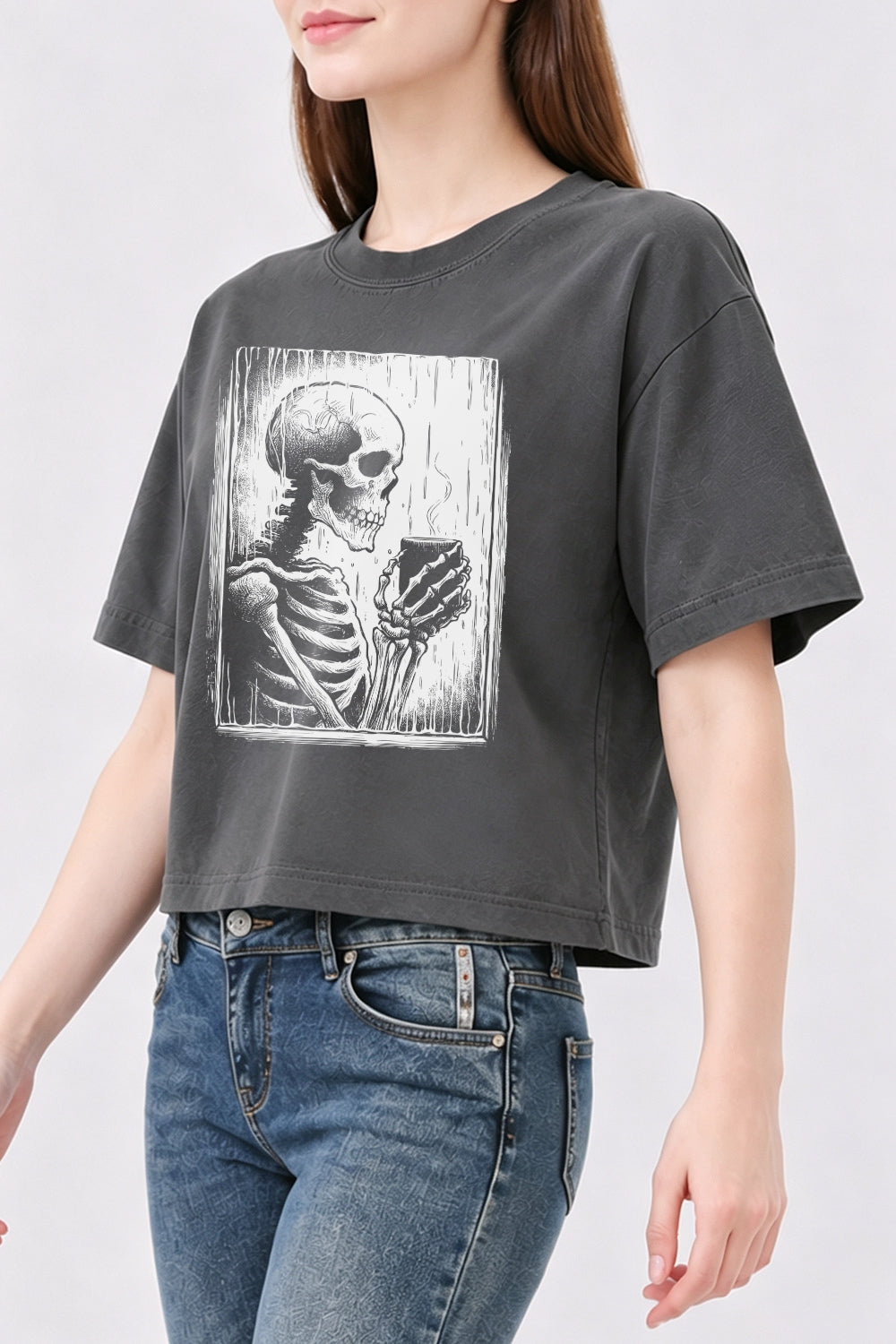Skeleton holding a hot drink crop top