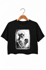 Skeleton holding a hot drink crop top
