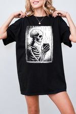 Skeleton holding a hot drink tee