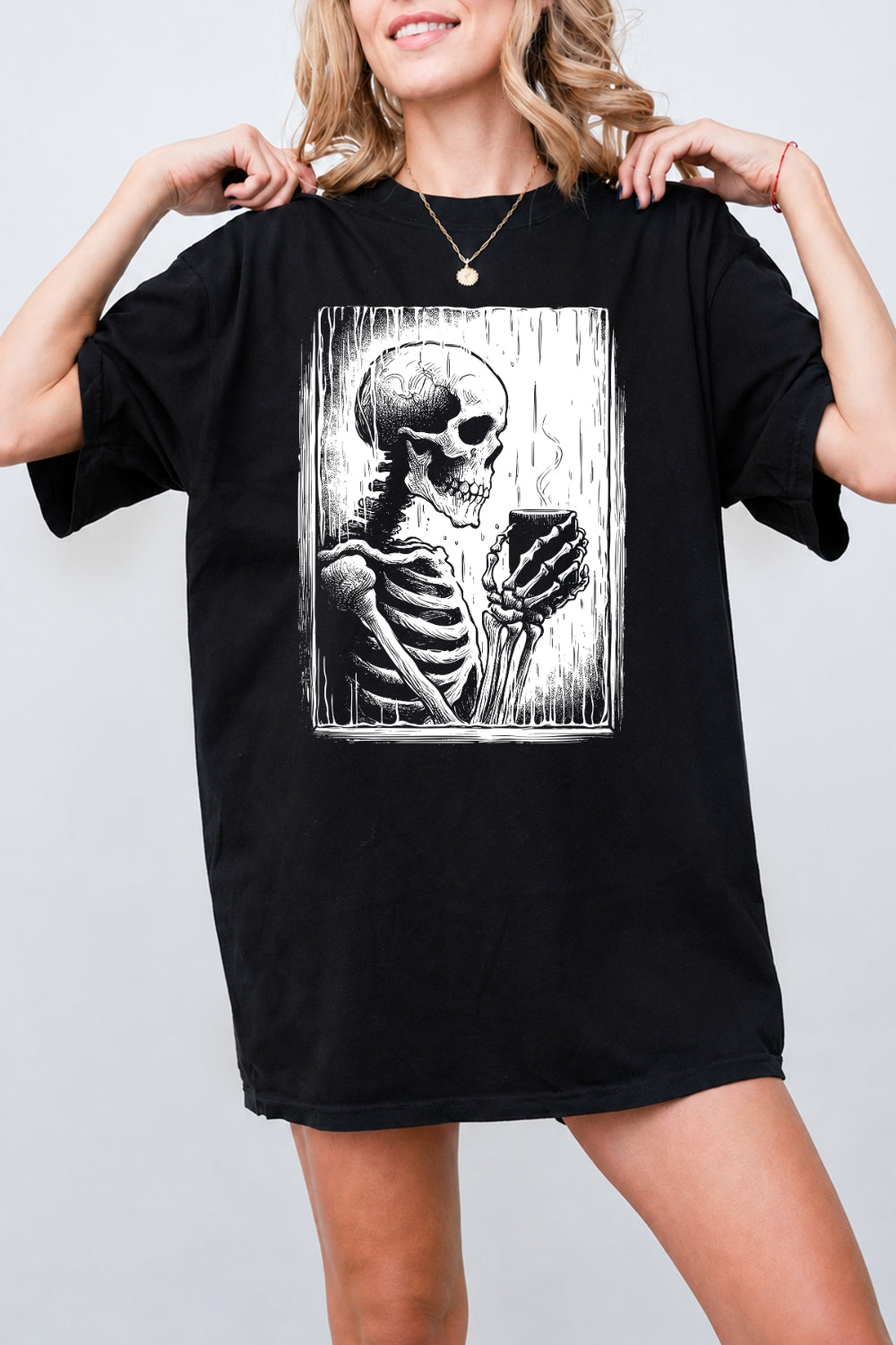 Skeleton holding a hot drink tee