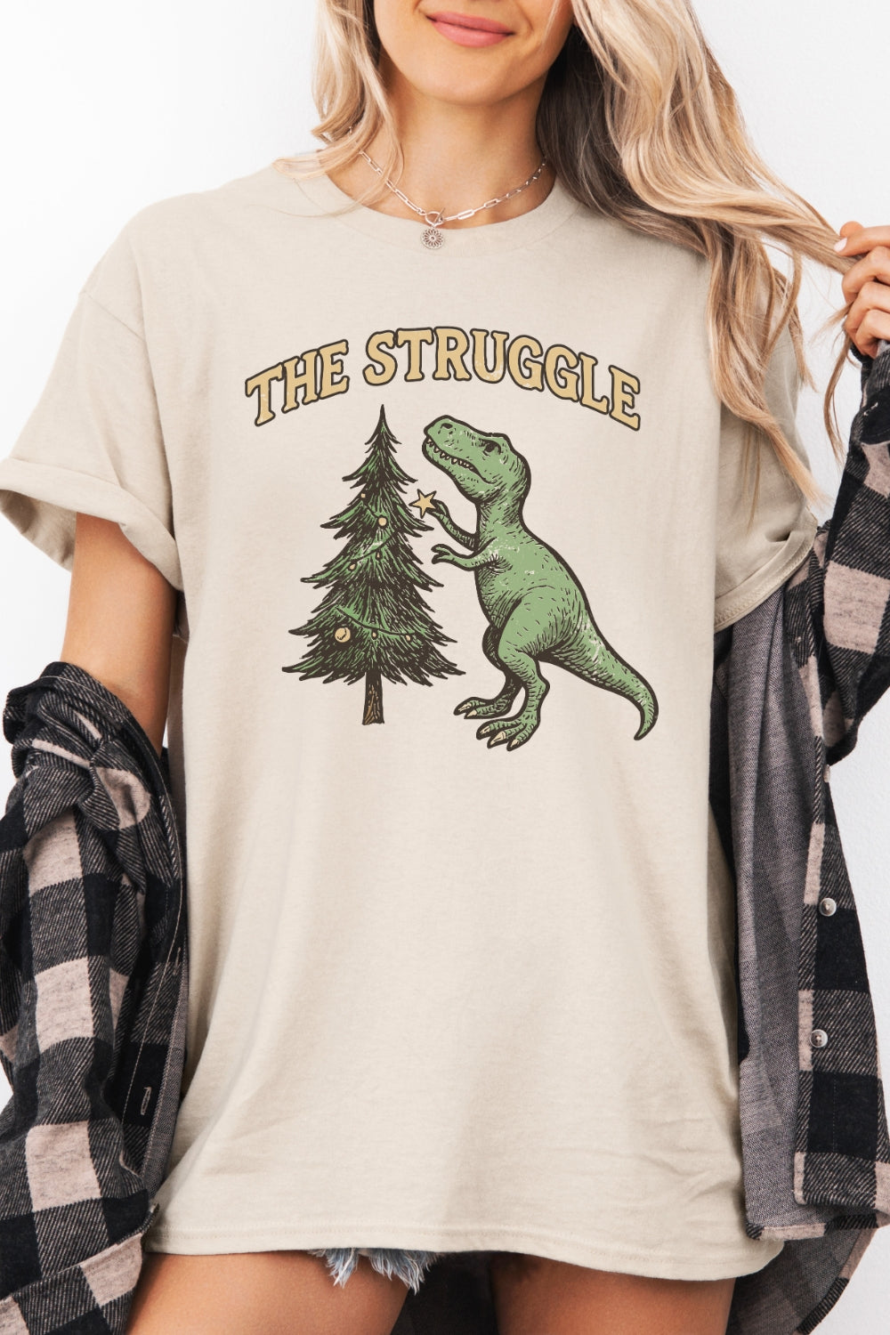 The struggle dinosaur christmas tee